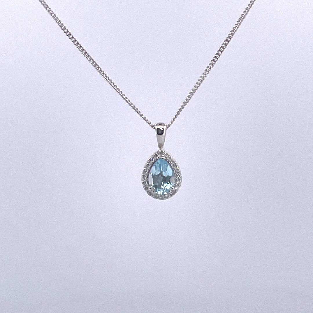P2515 9ct white gold pear shape blue topaz and diamond cluster