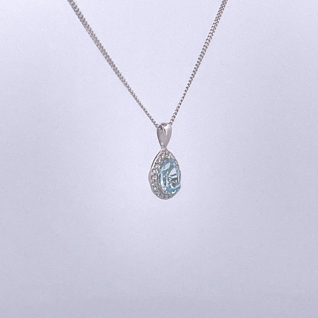 P2515 9ct white gold pear shape blue topaz and diamond cluster