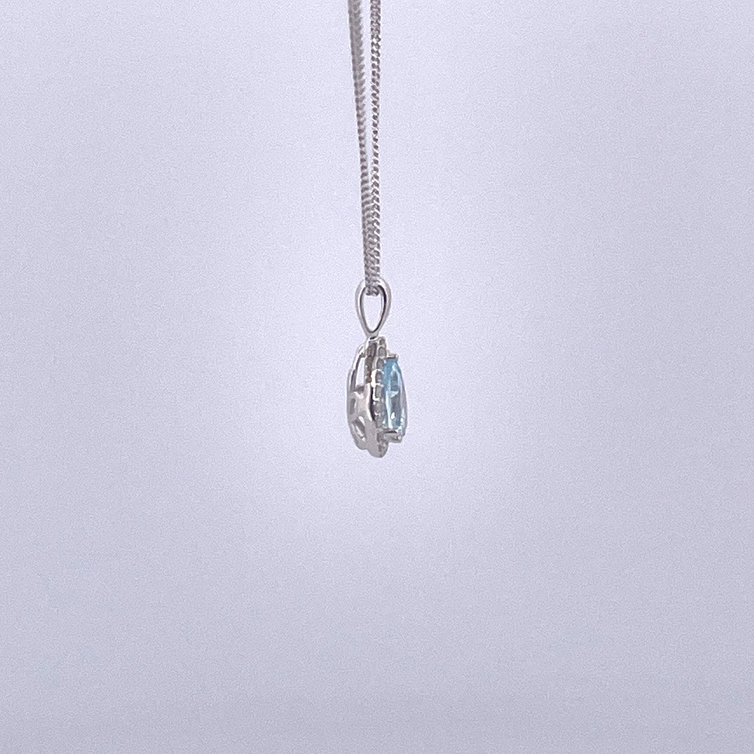 P2515 9ct white gold pear shape blue topaz and diamond cluster