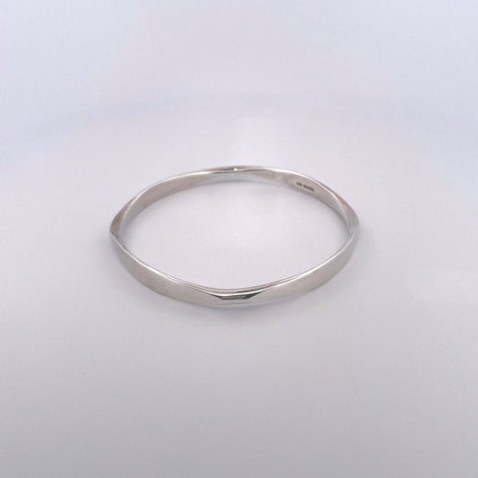 B1089 Silver round bangle with four facets handmade