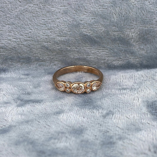 R0759 9ct Morganite Rose gold seven stone rub over 0.06ct