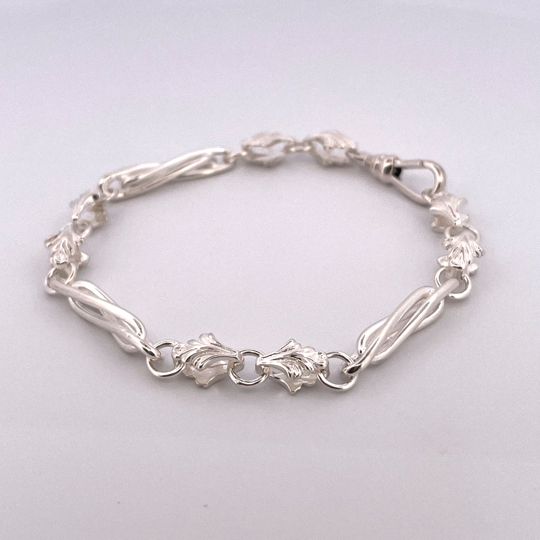B1163 Silver twisted bar and leaf style link bracelet